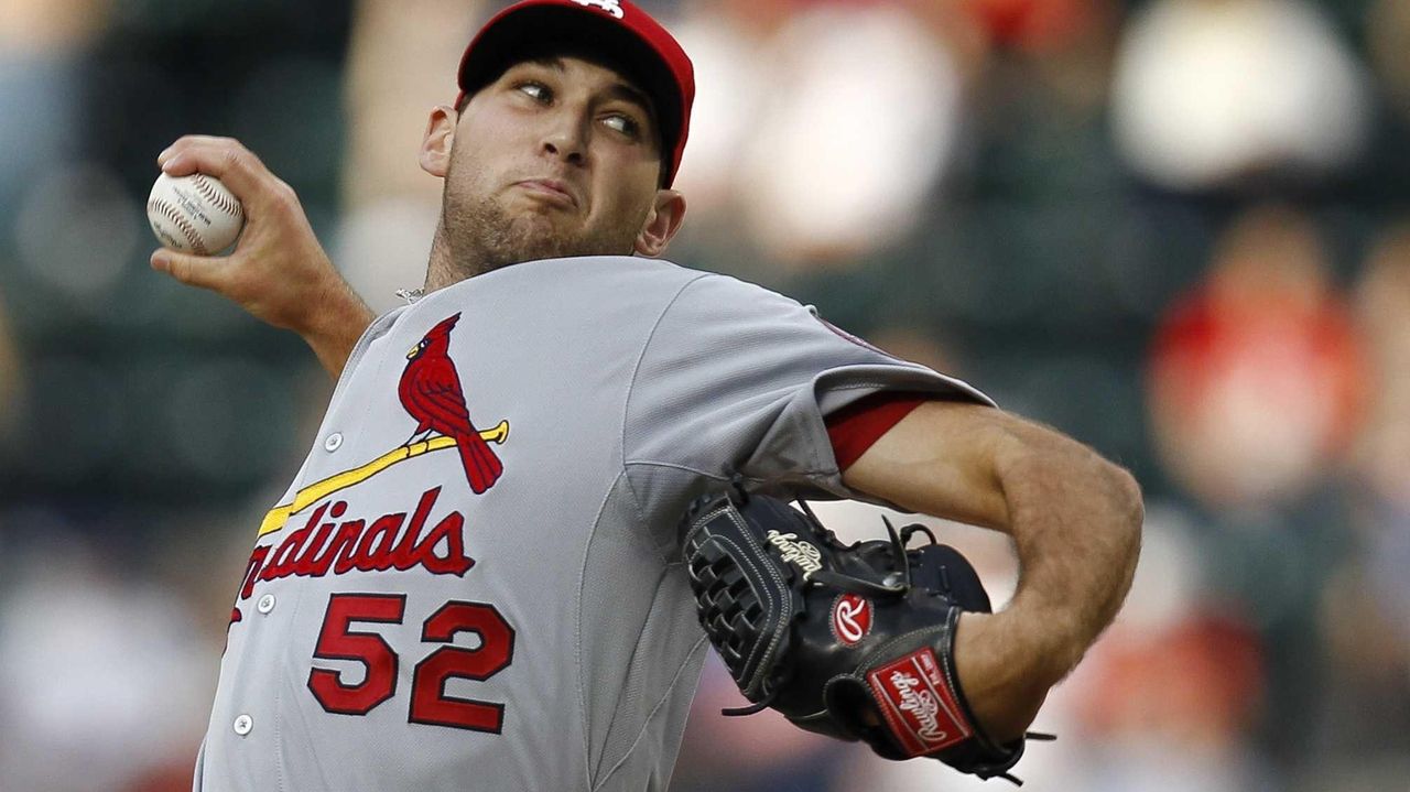 St. Louis Cardinals pitcher Michael Wacha can't make a play on a ball hit  by Washington Nationals Ryan Zimmerman in the ninth inning at Busch Stadium  in St. Louis on September 24