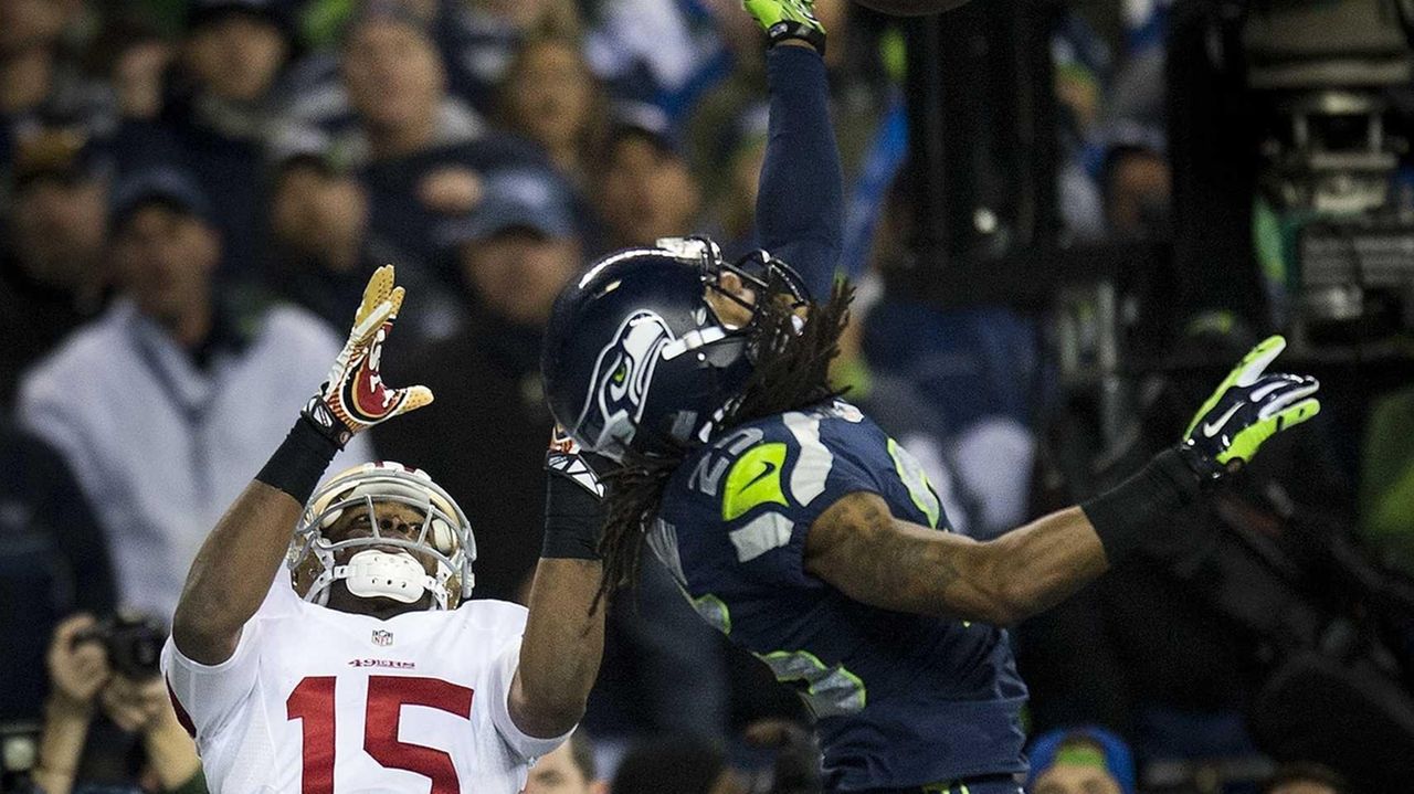 Seattle Seahawks cornerback Richard Sherman (25) gets looked over