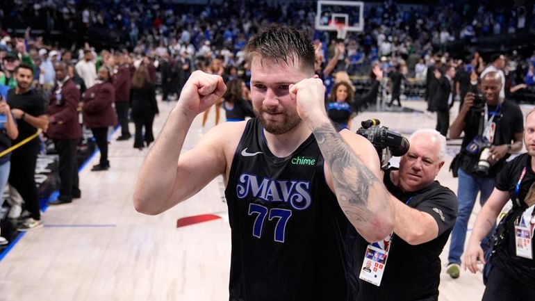 Dallas Mavericks' Luka Doncic celebrates the teams win in Game...