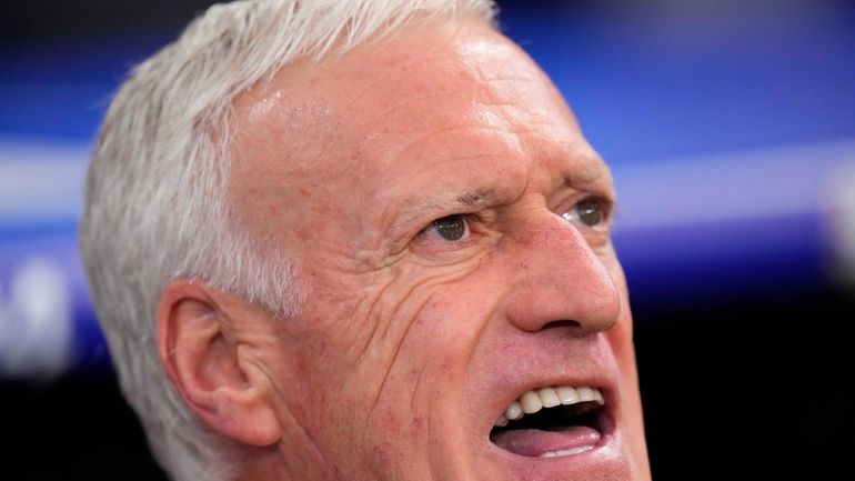 France head coach Didier Deschamps sings during the national anthem...