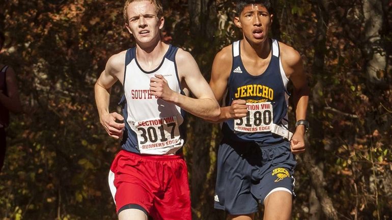 South Side's Kieran McCarthy, left, edges Jericho's Jose Velasquez to...