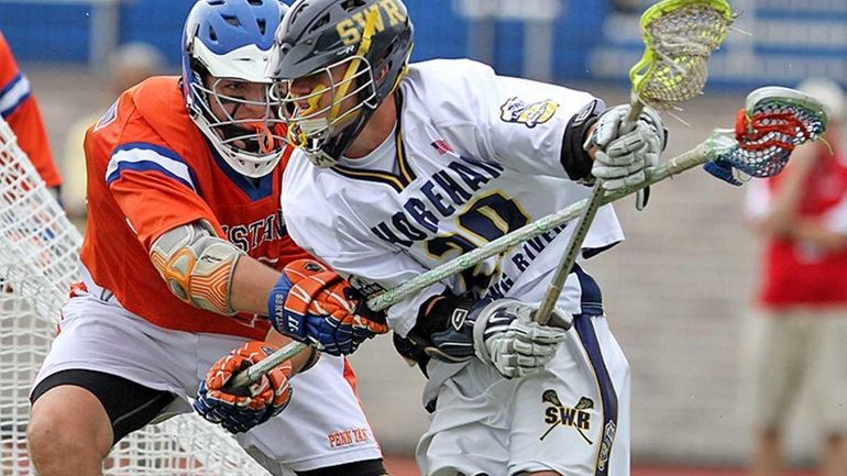 Shoreham-Wading River's Tim Rotanz gets ball hit away by Penn...