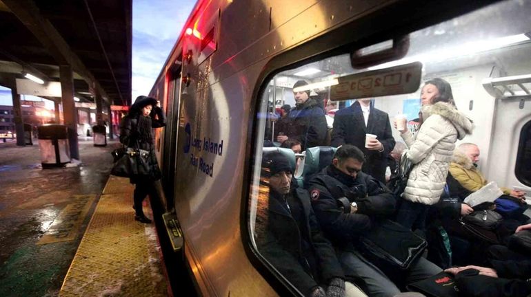 A file photo of a rider boarding a westbound train...