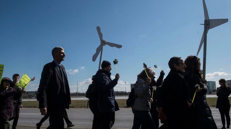 Environmental stakeholders, community groups and Long Island residents rally outside...