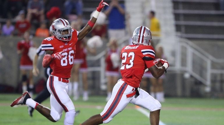 Stony Brook defensive back Kye Morgan #23 picked up a...