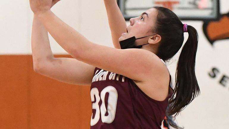 Garden City guard Ellie Pamatat shoots for a layup against...