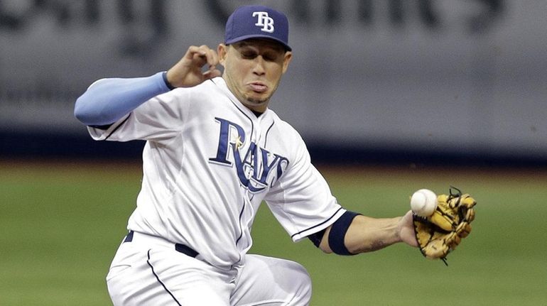 Tampa Bay Rays shortstop Asdrubal Cabrera, left, can't hang onto...