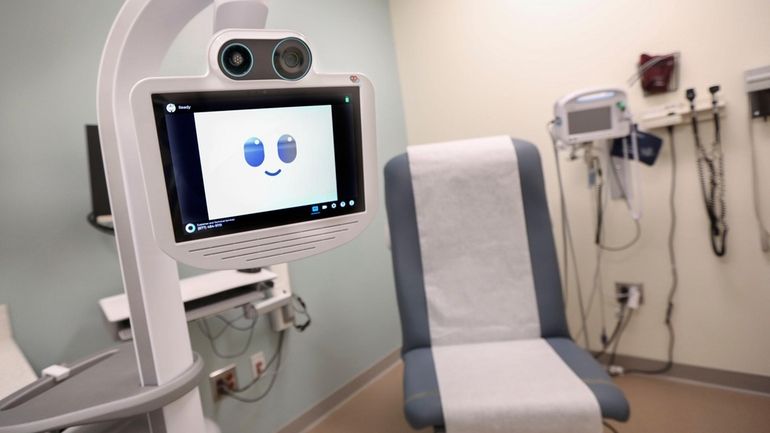 A rolling telehealth cart that allows physicians to meet with...