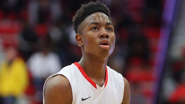 Half Hollow Hills East's Savion Lewis takes a foul shot...