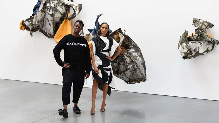 Mickalene Thomas and Racquel Chevremont in front of Kennedy Yanko’s...