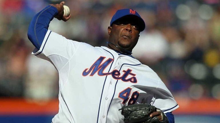 Frank Francisco pitches during the ninth inning of a game...