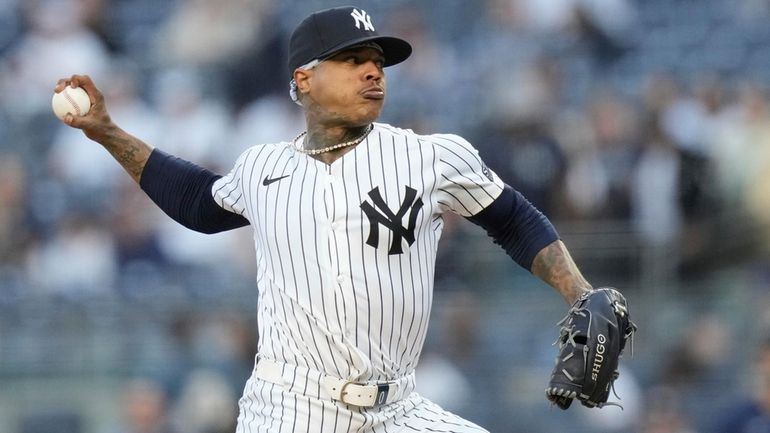 The Yankees' Marcus Stroman pitches during the first inning of...