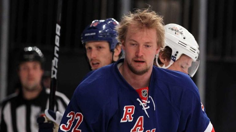 Anton Stralman of the New York Rangers looks on after...