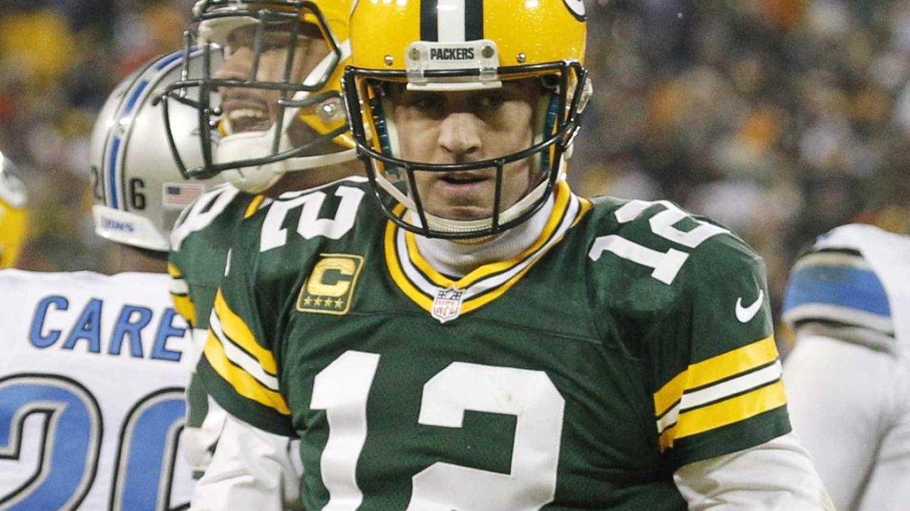 Limping Aaron Rodgers, Green Bay Packers beat Detroit Lions to win NFC ...
