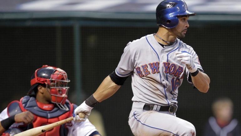 New York Mets' Angel Pagan watches his two-run single off...