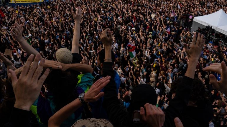 People gather at Republique plaza in a protest against the...