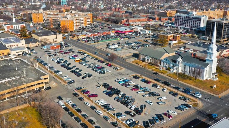 Parking lots near Front and Washington streets in Hempstead, as...