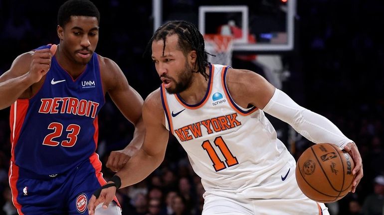 Jalen Brunson #11 of the Knicks drives against Jaden Ivey...