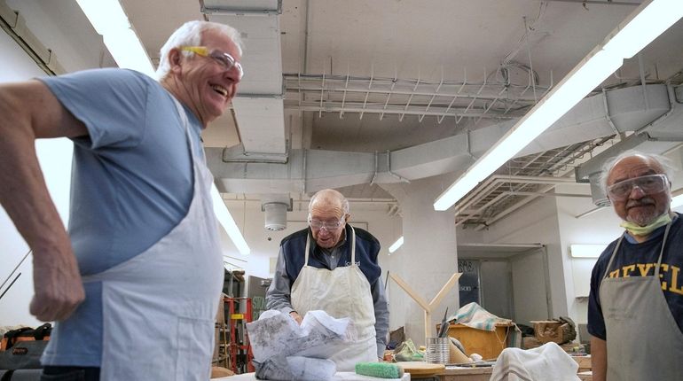 John Ditunno, 86, center, a doctor in rehabilitation medicine who...