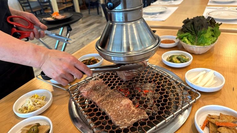 Galbi (sliced short rib) cooked at the table at Korean...