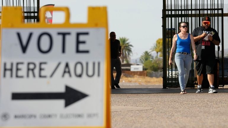 Voters walk to a voting station to cast their votes...