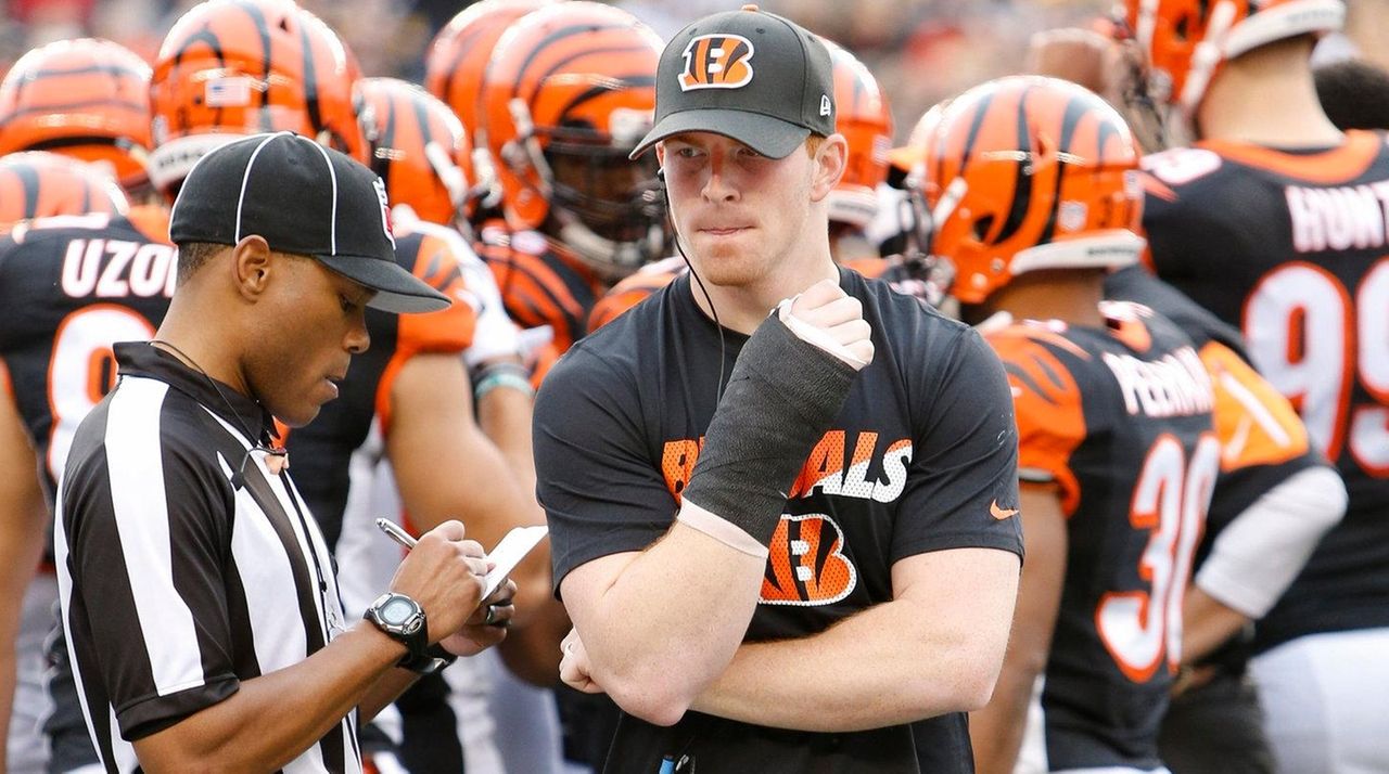 Cincinnati Bengals quarterback Andy Dalton (14) jogs off the field  following the come from behind 16-10 Bengals win against the Pittsburgh  Steelers at Heinz Field in Pittsburgh on November 1, 2015. Photo