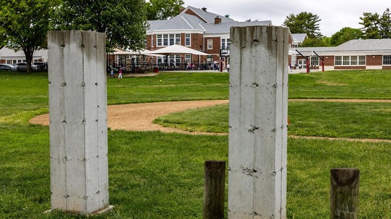 Parts of the fencing seen at North Side School in East...