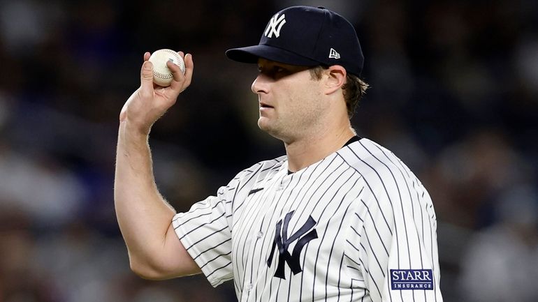 Gerrit Cole of the Yankees looks on against the Blue Jays...