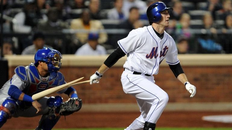 Mets first baseman Ike Davis singles for his first major...