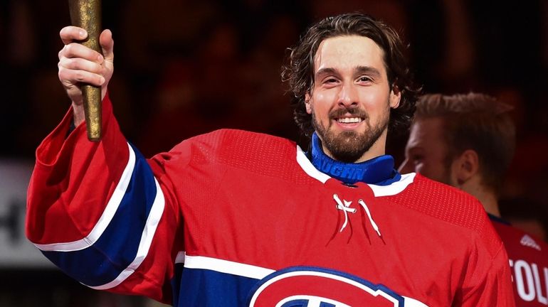 Keith Kinkaid of the Canadiens takes part in the opening...