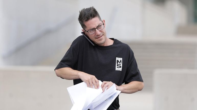 Matthew Schmitz, of Lindenhurst, leaves federal court in Central Islip...