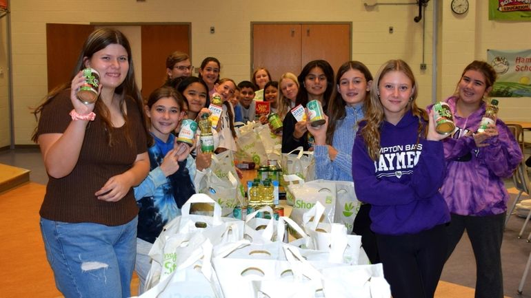 Members of Hampton Bays Middle School’s Organization of Willing Leaders...