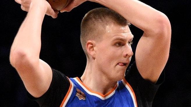 New York Knicks forward Kristaps Porzingis is defended by Brooklyn...
