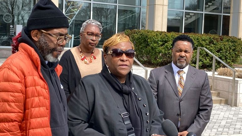 Timothy McCree Johnson's parents Melissa Johnson, center, and Timothy Walker,...