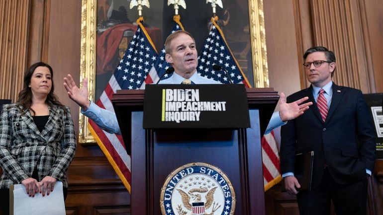 House Judiciary Committee Chairman Jim Jordan, R-Ohio, center, flanked by...