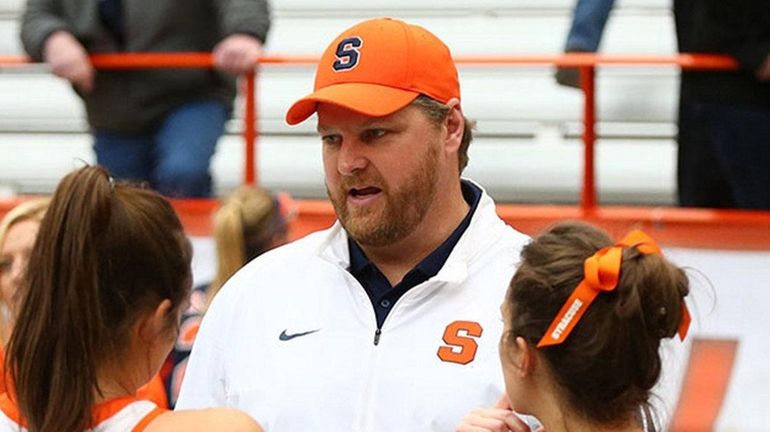 Syracuse associate head coach for women's lacrosse talks with players...