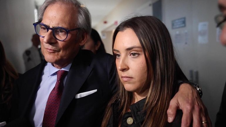 Amanda Burke with her lawyer, Robert C. Gottlieb, at First District Court...