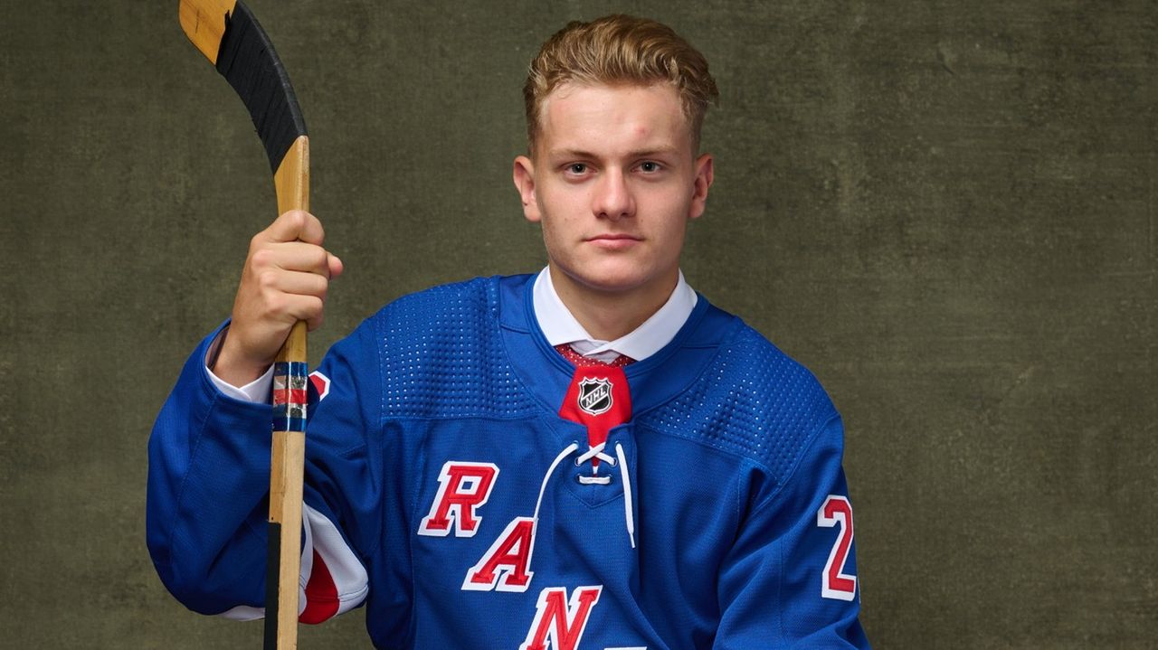 Juraj Slafkovsky poses for a headshot at the 2022 NHL Scouting News  Photo - Getty Images