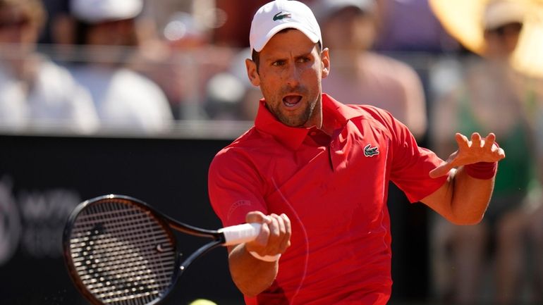 Serbia's Novak Djokovic returns the ball to Chile's Alejandro Tabilo...