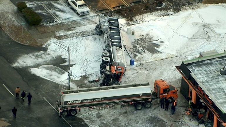 An aerial view of an overturned tanker truck on Sunrise...