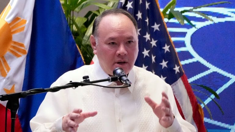 Philippine Defense Secretary Gilberto Teodoro Jr. gestures during his speech...