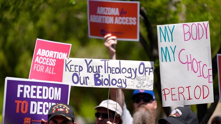 Abortion rights supporters gather outside the Capitol, Wednesday, April 17,...