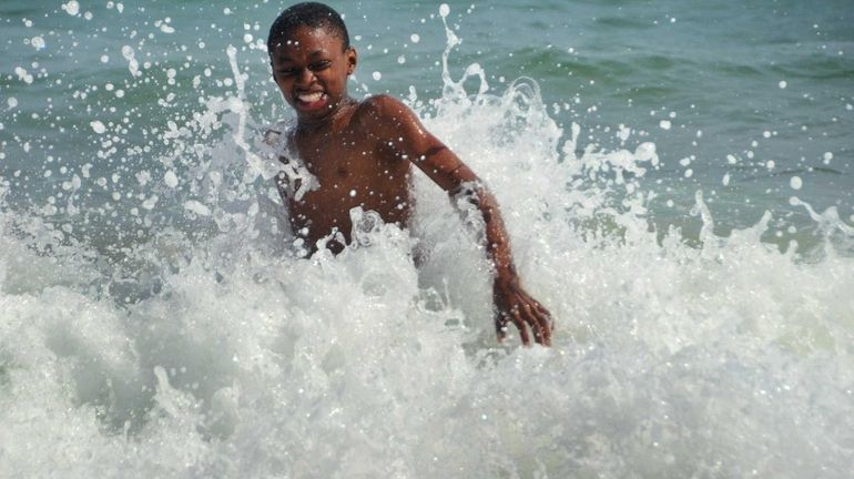 Tristyn Forde, 12, of Springfield Gardens, celebrates summer vacation and...