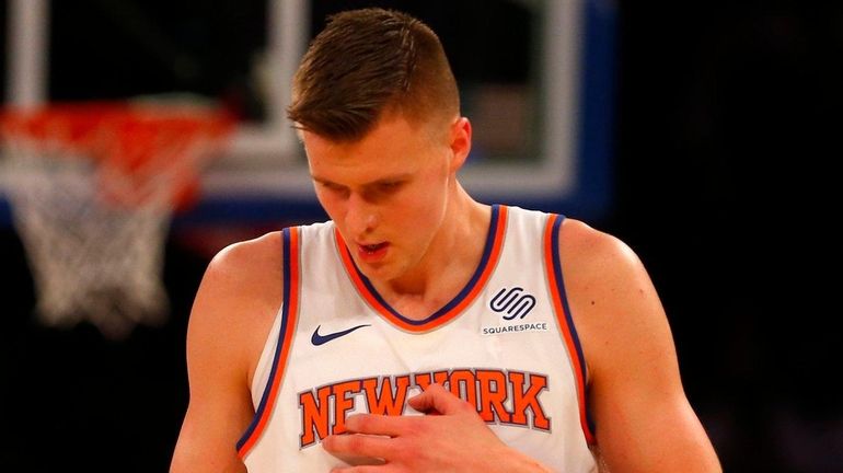 Knicks forward Kristaps Porzingis looks on during a game against...