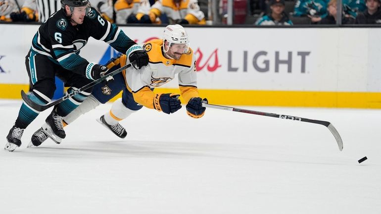 Nashville Predators left wing Filip Forsberg (9) is fouled from...