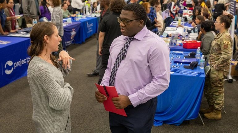 Suffolk County Parks and Recreation representative Kellyanne Sullivan, left, talks...