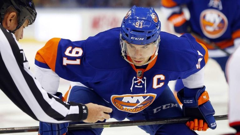 John Tavares of the Islanders waits to take a face...