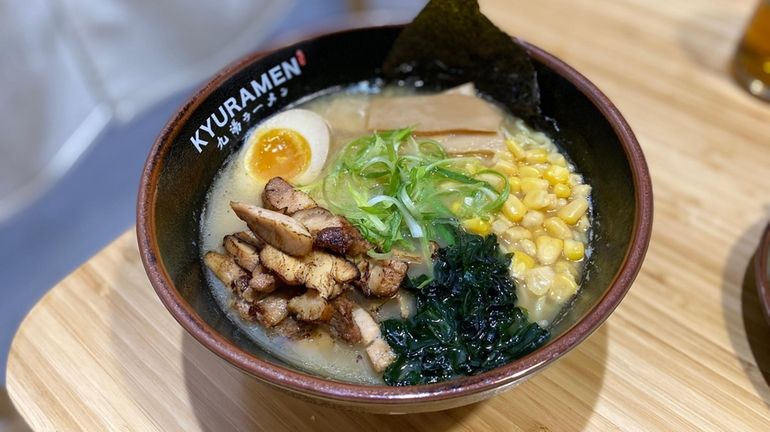 Kyuramen's chicken ramen layered with fresh corn, wakame seaweed and...