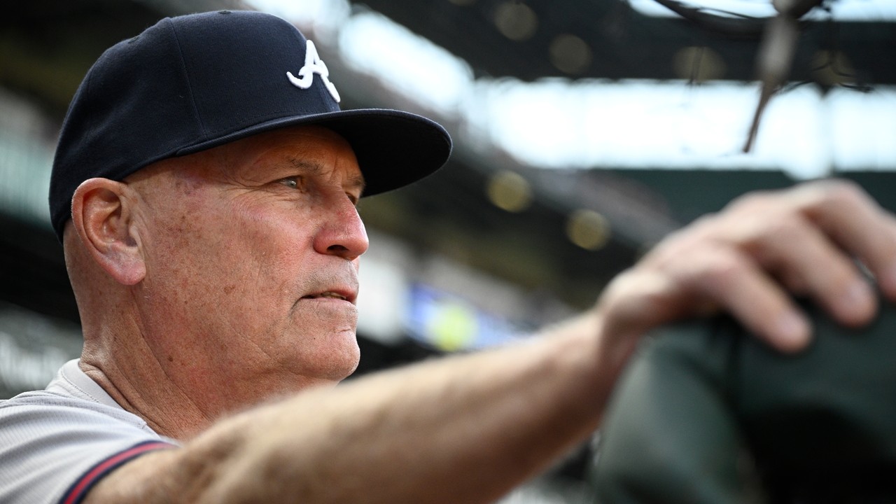 Braves manager Brian Snitker smiles 1 day after being hit below the ...