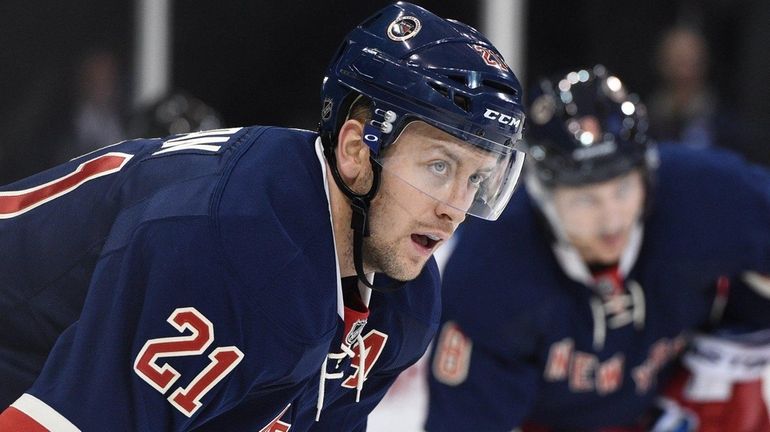 New York Rangers center Derek Stepan looks on before a...